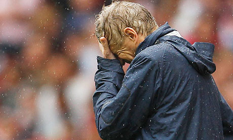 arsene-wenger-in-the-rain-anguish