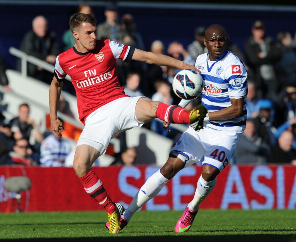 Aaron Ramsey Of Arsenal Challenges Stephane Mbia Of QPR… News Photo - Getty Images - 168029835