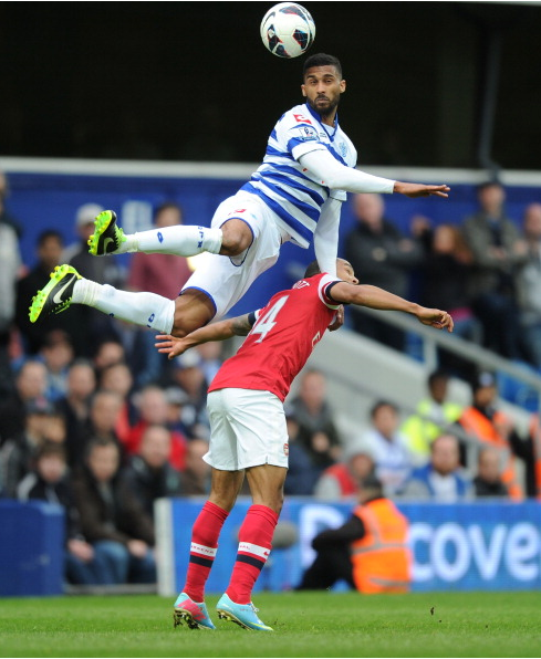 Armand Traore Of QPR Out Jumps Theo Walcott Of Arsenal… News Photo - Getty Images - 168029949