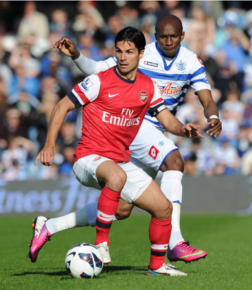 Mikel Arteta Of Arsenal Breaks Past Stephane Mbia Of QPR… News Photo - Getty Images - 168029840