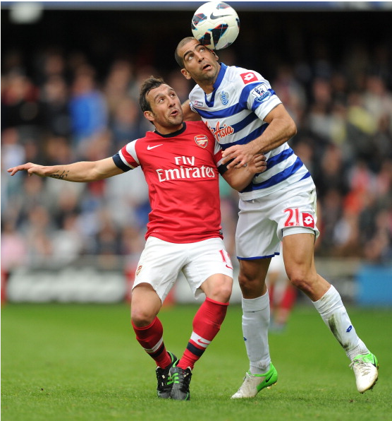 Santi Cazorla Of Arsenal Challenged By Tal Ben Haim Of QPR… News Photo - Getty Images - 168029961