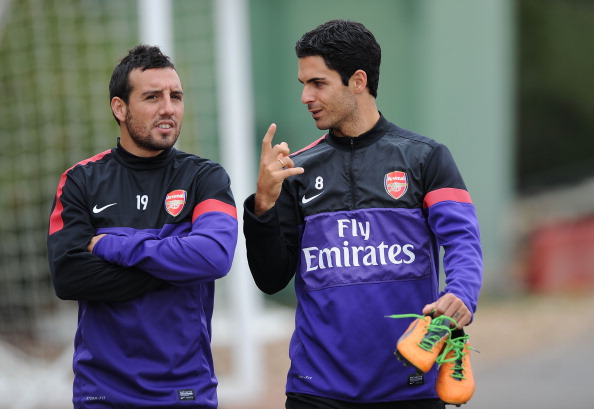 ST ALBANS, ENGLAND - SEPTEMBER 21:  (L-R) Santi Cazorla and Mikel Arteta of Arsenal during a training session at London Colney on September 21, 2012 in St Albans, England.  (Photo by Stuart MacFarlane/Arsenal FC via Getty Images)